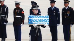 A soldier carries a casket containing the remains of a U.S. soldier who was killed in the Korean War during a ceremony at Osan Air Base in Pyeongtaek, South Korea, July 27, 2018. REUTERS/Kim Hong-Ji/Pool