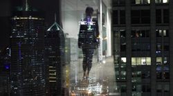 FILE PHOTO: A woman is reflected in a window of an office in Shanghai. REUTERS/Carlos Barria
