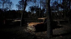Burnt cars are seen following a wildfire in the village of Mati, near Athens, Greece, July 27, 2018. REUTERS/Costas Baltas