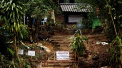 A "Restricted Area" sign is seen in front of the Tham Luang cave complex, after the rescue mission for the 12 boys of the "Wild Boars" soccer team and their coach, in the northern province of Chiang Rai, Thailand July 14, 2018. REUTERS/Tyrone Siu/File Photo