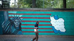 FILE PHOTO: A man walks past an anti-U.S. mural in Tehran, Iran October 13, 2017. Nazanin Tabatabaee Yazdi/TIMA via REUTERS