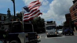 A U.S. flag flies from the back of a car, ahead the one-year anniversary of the fatal white-nationalist rally, in Charlottesville, Virginia, U.S., August 1, 2018. REUTERS/Brian Snyder