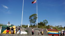 FILE PHOTO: People stand at the border with Venezuela, seen from the Brazilian city of Pacaraima, Roraima state, Brazil November 16, 2017. REUTERS/Nacho Doce/File photo