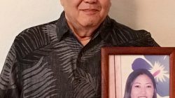 George Young holds a framed photo of his late daughter Tim Young in Hilo, Hawaii, U.S., July 30, 2018. Picture taken July 30, 2018. Courtesy Lynn Viale/Handout via REUTERS