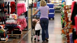 FILE PHOTO: A woman shops with her daughter at a Walmart Supercenter in Rogers, Arkansas, U.S., June 6, 2013. REUTERS/Rick Wilking/File Phot