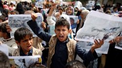 Boys demonstrate outside the offices of the United Nations in Sanaa, Yemen to denounce last weeks air strike that killed dozens including children in the northwestern province of Saada, August 13, 2018. REUTERS/Khaled Abdullah