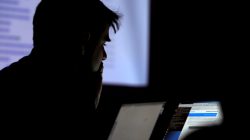 FILE PHOTO: A man takes part in a hacking contest during the Def Con hacker convention in Las Vegas, Nevada, U.S. on July 29, 2017. REUTERS/Steve Marcus/File Photo