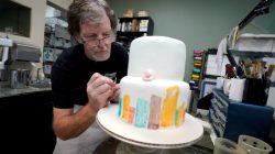FILE PHOTO: Baker Jack Phillips decorates a cake in his Masterpiece Cakeshop in Lakewood, Colorado U.S. on September 21, 2017. REUTERS/Rick Wilking/File Photo