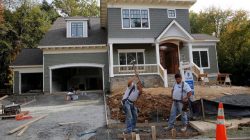 FILE PHOTO: Construction workers are pictured building a new home in Vienna, Virginia, outside of Washington, October 20, 2014./File Photo