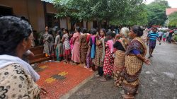 Flood-affected women wait in a queue to receive relief material at a camp in Chengannur in the southern Indian state of Kerala, India, August 20, 2018. REUTERS/Amit Dave