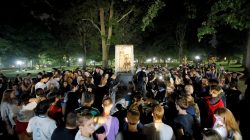 Students and protesters surround plinth where the toppled statue of a Confederate soldier nicknamed Silent Sam once stood, on the University of North Carolina campus after a demonstration for its removal in Chapel Hill, North Carolina, U.S. August 20, 2018. REUTERS/Jonathan Drake