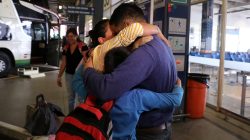Venezuelan migrant Plaza Pernia family hug as they arrive from the northern city of Tumbes, border with Ecuador, to the bus terminal in Lima, Peru August 22, 2018. REUTERS/Guadalupe Pardo