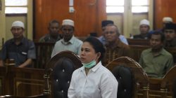 Meiliana, a 44-year-old ethnic Chinese Buddhist, sits in a courtroom for blasphemy charges, in Medan, Sumatra, Indonesia August 21, 2018, in this photo taken by Antara Foto. Picture taken August 21, 2018. Antara Foto/Irsan Mulyadi/via REUTERS