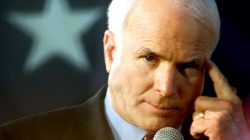 FILE PHOTO - Republican presidential hopeful John McCain points to his head during his Carolina kickoff rally at Presbyterian College February 2, 2000. REUTERS/Kevin Lamarque/File Photo