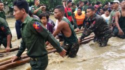 People are evacuated by Myanmar soldiers after flooding in Swar township, Myanmar August 29, 2018. REUTERS/Stringer