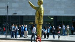 People stand near a statue of Turkish President Tayyip Erdogan during the art exhibition "Wiesbaden Biennale" in Wiesbaden, Germany, August 28, 2018. REUTERS/Ralph Orlowski