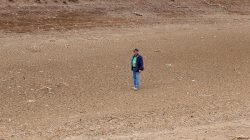 Farmer Kevin Tongue stands in a dried-up dam on his drought-effected property of 'Glenwood' located on the outskirts of the town of Tamworth, north-west of Sydney in Australia, August 25, 2018. Picture taken August 25, 2018. REUTERS/Jill Gralow
