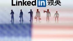 Small toy figures are seen between displayed U.S. flag and Linkedin logo in this illustration picture, August 30, 2018. To match Exclusive LINKEDIN-CHINA/ESPIONAGE REUTERS/Dado Ruvic/Illustration