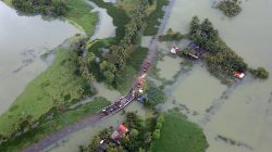 An aerial view shows a partially submerged road at a flooded area in the southern state of Kerala, India, August 19. REUTERS/Sivaram V