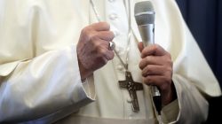 FILE PHOTO: Pope Francis speaks with the media onboard a plane during his flight back from a trip in Dublin, Ireland August 26, 2018. Gregorio Borgia/Pool/File Photo