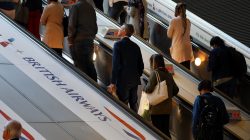 Commuters pass a British Airways advert on the tube at Canary Wharf station in London, Britain September 7, 2018. REUTERS/Kevin Coombs
