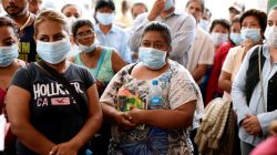 Relatives of missing persons are seen outside the morgue after attending a viewing of photographs of clothing, accessories and identification cards found on bodies recovered recently from mass graves in Xalapa, in the Mexican state of Veracruz, Mexico September 11, 2018. REUTERS/Yahir Ceballos