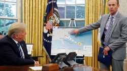 U.S. President Donald Trump holds an Oval Office meeting on hurricane preparations as FEMA Administrator Brock Long points to the potential track of Hurricane Florence on a graphic at the White House in Washington, U.S., September 11, 2018. REUTERS/Leah Millis