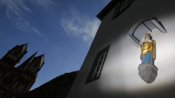 FILE PHOTO - A statue of the Virgin Mary adorns the facade of the bishop's residence next to Limburg Cathedral October 14, 2013. REUTERS/Kai Pfaffenbach