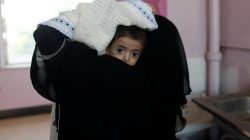 A woman carries a child at the malnutrition ward of al-Sabeen hospital in Sanaa, Yemen September 11, 2018. REUTERS/Khaled Abdullah
