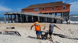 People work in the reconstruction of Rodanthe pier after being partially damaged after the pass of Hurricane Florence, now downgraded to a tropical depression in Rodanthe, North Carolina, U.S., September 18, 2018. REUTERS/Eduardo Munoz