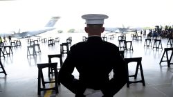 FILE PHOTO: A U.S. Marine stands as caskets containing the remains of American servicemen from the Korean War handed over by North Korea arrive at Joint Base Pearl Harbor-Hickam in Honolulu, Hawaii, Aug. 1, 2018. REUTERS/Hugh Gentry/File Photo