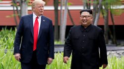 FILE PHOTO: U.S. President Donald Trump and North Korean leader Kim Jong Un walk after lunch at the Capella Hotel on Sentosa island in Singapore June 12, 2018. REUTERS/Jonathan Ernst/File Photo