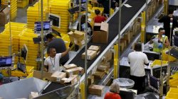 Workers sort arriving products at an Amazon Fulfilment Center in Tracy, California August 3, 2015. REUTERS/Robert Galbraith