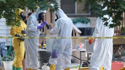 FBI and law enforcement officers in hazmat suites prepare to enter a house, which FBI says was investigating "potentially hazardous chemicals" in Logan, Utah, U.S., October 3, 2018. REUTERS/George Frey
