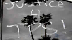 Paint is seen on cars before members of the Teamsters Union participate in a tractor trailer caravan surrounding the LA Metro Detention Center in support of port truck drivers and others threatened by deportation if the courts or congress don't stop the termination of Temporary Protected Status (TPS) in Los Angeles, California, U.S. October 3, 2018. REUTERS/Kyle Grillot