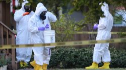 FBI and law enforcement officers in hazmat suites prepare to enter a house, which FBI says was investigating "potentially hazardous chemicals" in Logan, Utah, U.S., October 3, 2018. REUTERS/George Frey