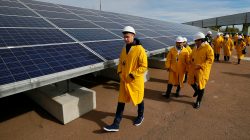 Visitors walk past solar panels at a solar power plant built on the site of the world's worst nuclear disaster, Chernobyl, Ukraine October 5, 2015. REUTERS/Gleb Garanich