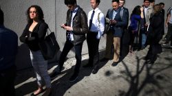 FILE PHOTO: People wait in line to attend TechFair LA, a technology job fair, in Los Angeles, California, U.S., January 26, 2017. REUTERS/Lucy Nicholson - RC1458E83C90