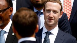 Facebook's CEO Mark Zuckerberg listens to French President Emmanuel Macron after a family picture with guests of the "Tech for Good Summit" at the Elysee Palace in Paris, France, May 23, 2018. REUTERS/Charles Platiau/Pool
