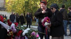 People attend a ceremony in memory of victims of a recent attack on a local college in the city of Kerch, Crimea October 18, 2018. REUTERS/Pavel Rebrov