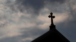 Storm clouds pass over a Roman Catholic church in Pittsburgh, Pennsylvania, U.S. August 14, 2018. REUTERS/Jason Cohn