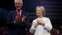 Democratic U.S. presidential candidate Hillary Clinton stands onstage with her husband former President Bill Clinton (L) after speaking during her California primary night rally held in the Brooklyn borough of New York, U.S., June 7, 2016. REUTERS/Shannon Stapleton