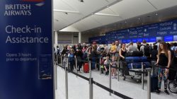 FILE PHOTO - People queue with their luggage for the British Airways check-in desk at Gatwick Airport in southern England, Britain, May 28, 2017. REUTERS/Hannah McKay