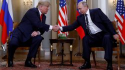 FILE PHOTO: U.S. President Donald Trump and Russia's President Vladimir Putin shake hands as they meet in Helsinki, Finland July 16, 2018. REUTERS/Kevin Lamarque