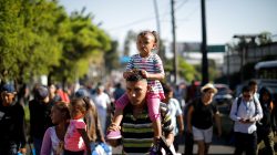 People walk in a caravan of migrants departing from El Salvador en route to the United States, in San Salvador, El Salvador, October 31, 2018. REUTERS/Jose Cabezas