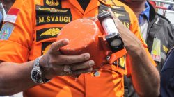 Chief of National Search and Rescue Agency Muhammad Syaugi shows a part of the black box of Lion Air's flight JT610 airplane, on Baruna Jaya ship, in the north sea of Karawang, Indonesia, November 1, 2018. Antara Foto/Muhammad Adimaja via REUTERS