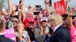 Supporters applaud U.S. President Donald Trump as he arrives to attend a campaign rally at Middle Georgia Regional Airport in Macon, Georgia, U.S., November 4, 2018. REUTERS/Jonathan Ernst/File Photo