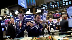 FILE PHOTO: Traders work on the floor of the New York Stock Exchange (NYSE) in New York, U.S., October 11, 2018. REUTERS/Brendan McDermid/File Photo